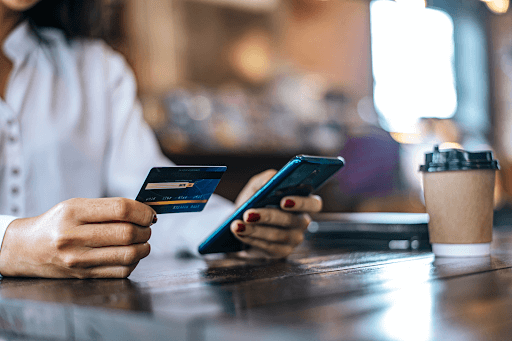 Person completing mobile payment with credit card